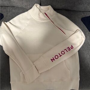 Peloton Cream Quarter-Zip Sweatshirt with Pink Sleeve Logo